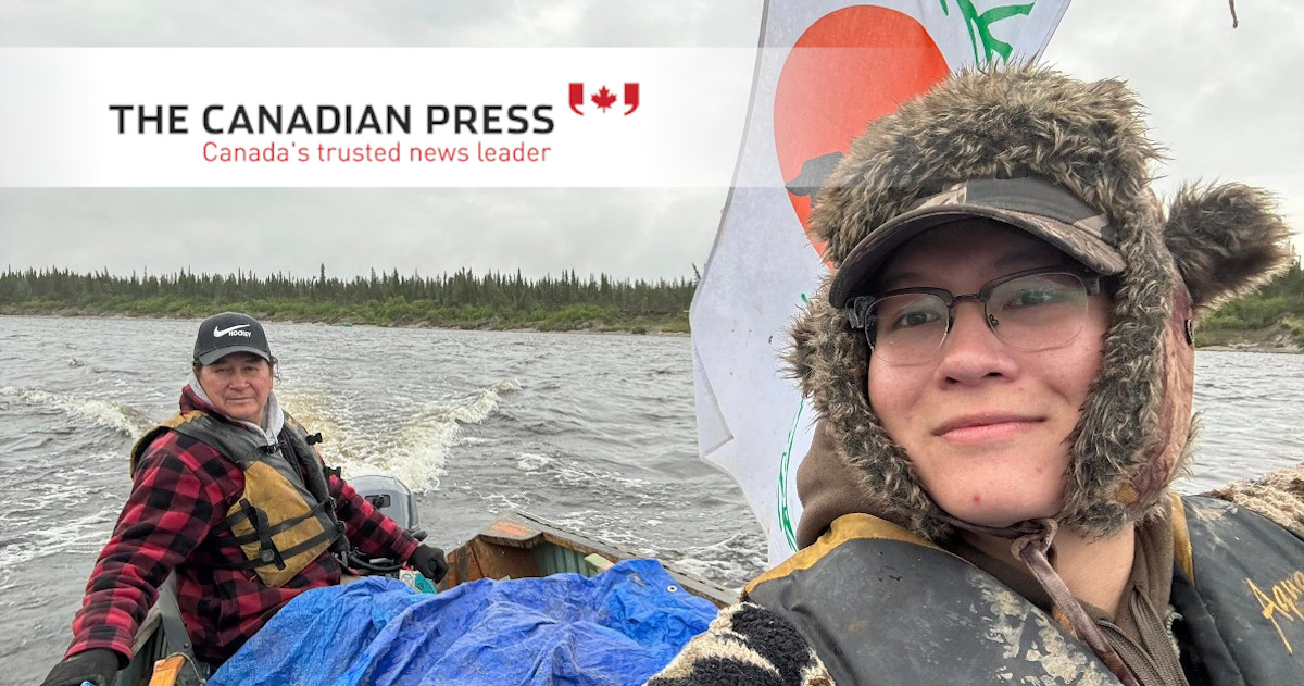 Jeronimo Kataquapit, right, and his father James A. Kataquapit, from Attawapiskat First Nation, are shown on the Attawapiskat River in this recent handout photo. THE CANADIAN PRESS/Handout - Jeronimo Kataquapit (Mandatory Credit)