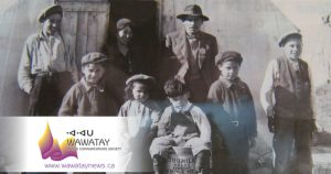 This faded historical photo features my grandfather James Kataquapit who was Chief of Attawapiskat in 1945. Here we see him standing with a hat and pin signifying his leadership. His wife Janie Kataquapit is standing at the door. Chief Kataquapit was also a veteran of the First World War. From L-R are his children: Thomas, Marius, Celine, David, Gabriel and Alex. Missing are brothers George and Leo.