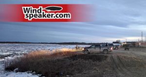 A photo of Attawapiskat FN residents viewing the breaking ice of the Attawapiskat River on May 20, 2026 - photo by Joseph Kataquapit