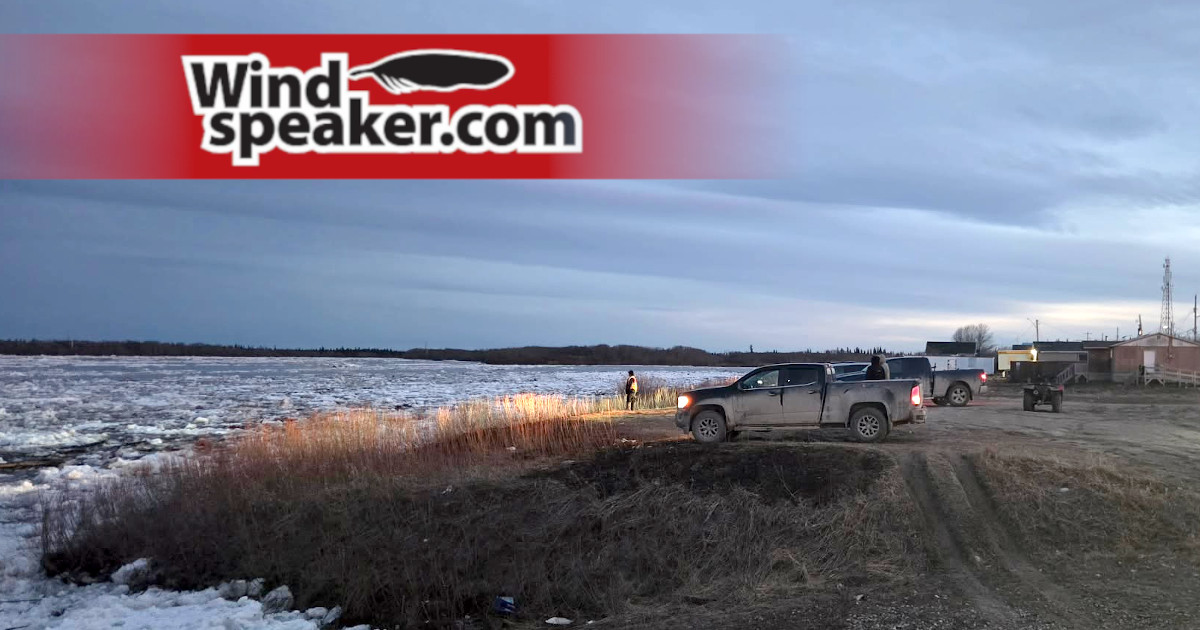 A photo of Attawapiskat FN residents viewing the breaking ice of the Attawapiskat River on May 20, 2026 - photo by Joseph Kataquapit
