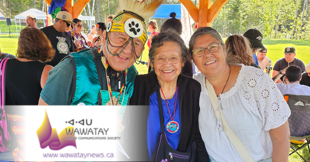 Many First Nations come together at every Pow Wow to celebrate culture and heritage. At the Matachewan FN Annual Pow Wow which ran August 29 and 30 are from L-R: Traditional Dancer George Rose, Attawapiskat FN; Elder Vina Hendrix-Landry, Matachewan FN and Betty Naveau, Mattagami FN. photo by Xavier Kataquapit